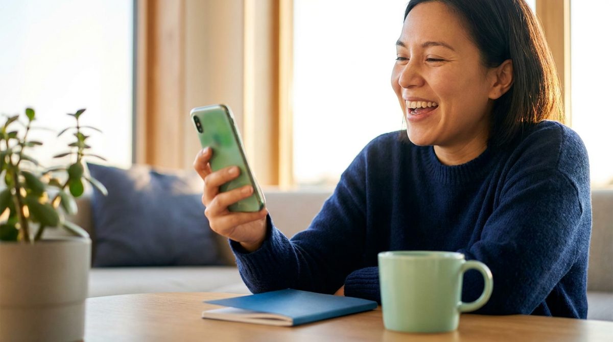 How to Get Approved for a Bad Credit Personal Loan Person relieved after getting approved for a bad credit personal loan on their phone